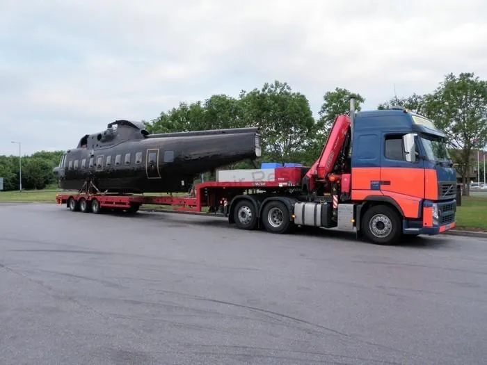 plane on back of lorry